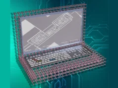 Penn State desarrolla la primera computadora 2D sin silicio del mundo Ilustración conceptual de un portátil construido con estructuras atómicas simuladas, mostrando una red de átomos tipo celosía formando la carcasa. En la pantalla se muestra una imagen microscópica de un circuito electrónico con el texto "Penn State Nanofab" y "Zeiss Gemini 500". El fondo es azul con patrones de circuitos impresos.