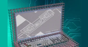 Ilustración conceptual de un portátil construido con estructuras atómicas simuladas, mostrando una red de átomos tipo celosía formando la carcasa. En la pantalla se muestra una imagen microscópica de un circuito electrónico con el texto "Penn State Nanofab" y "Zeiss Gemini 500". El fondo es azul con patrones de circuitos impresos.